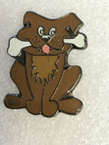 Small brown  dog with a bone pin badge0
