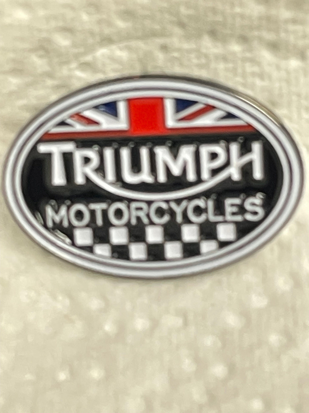 Triumph and Union Flag Pin Badge